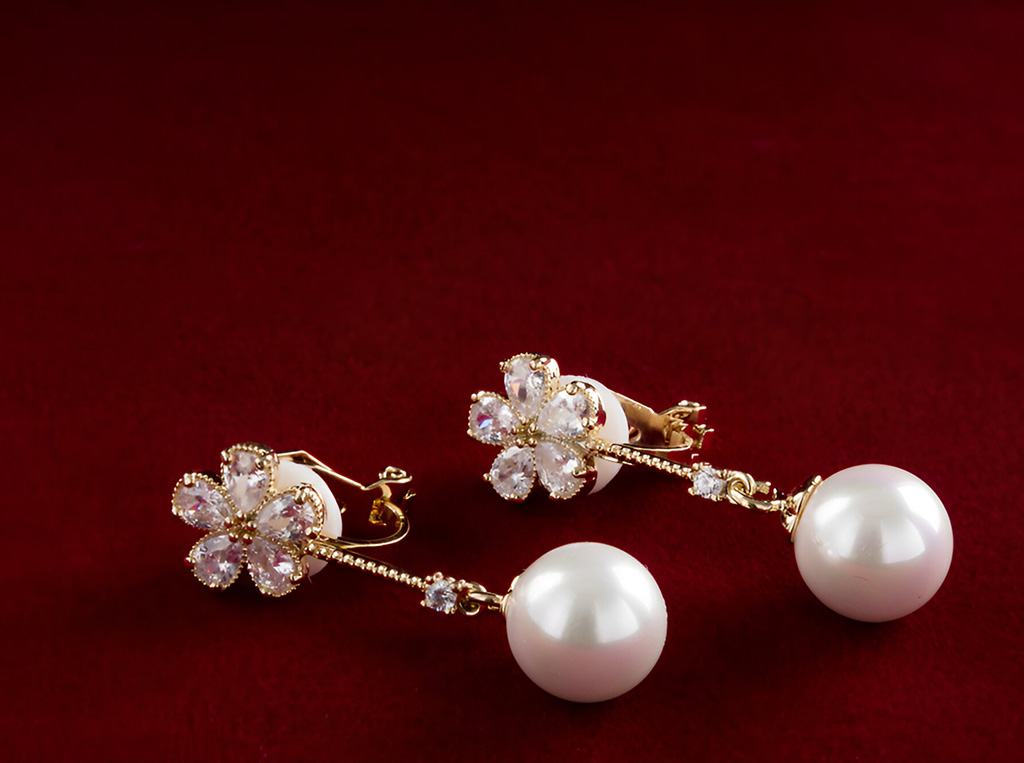a pair of pearl earrings