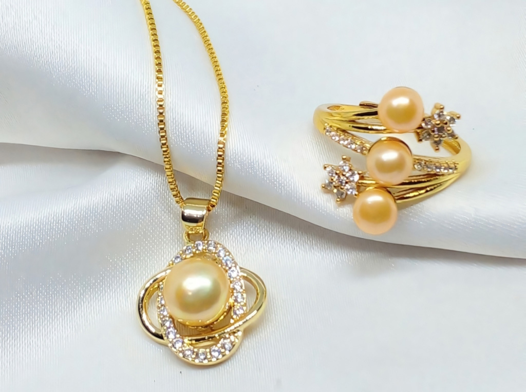 golden pearl ring and necklace